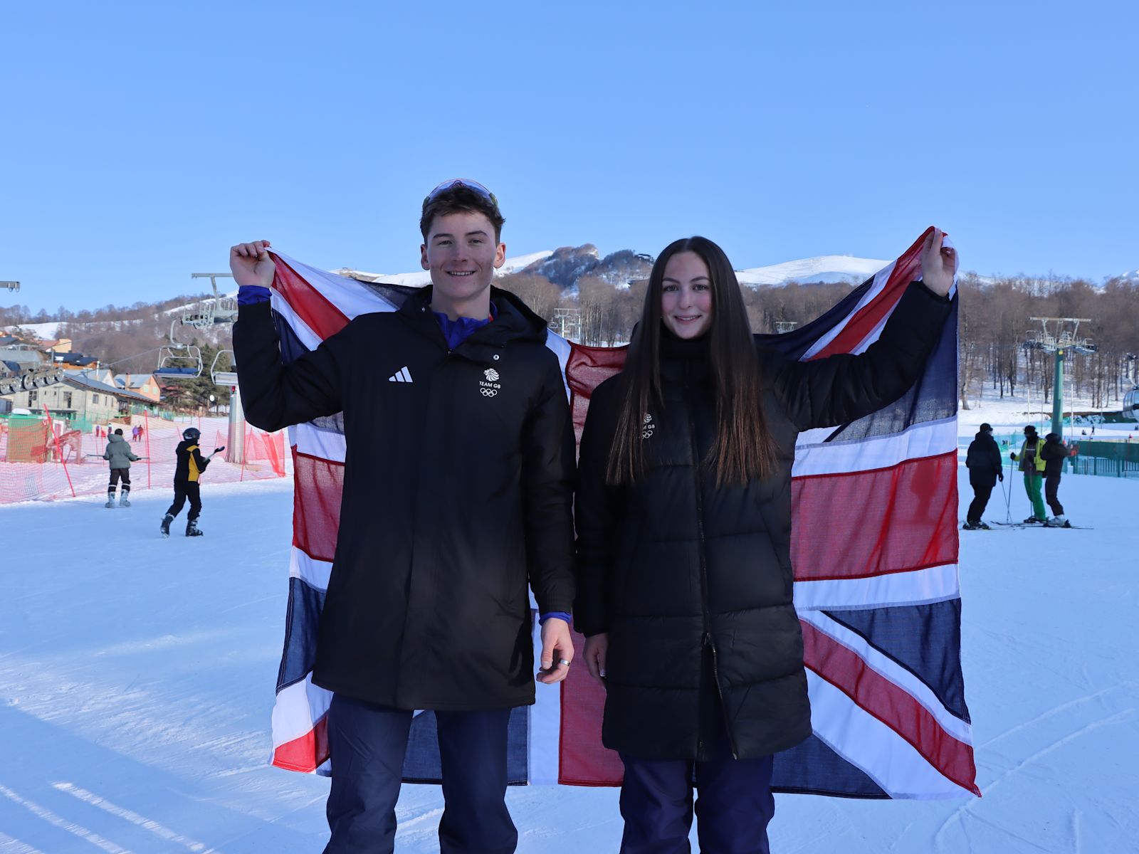 Snowsport athletes carry flag at EYOF 2025